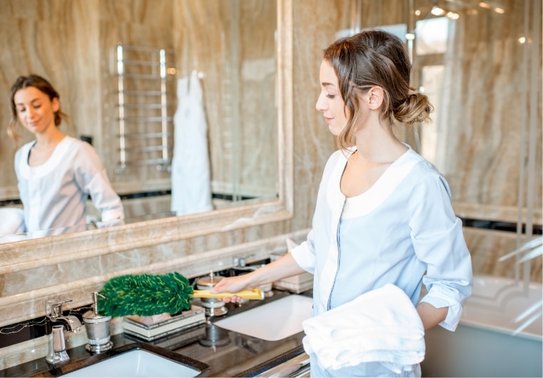 woman cleaning washroom