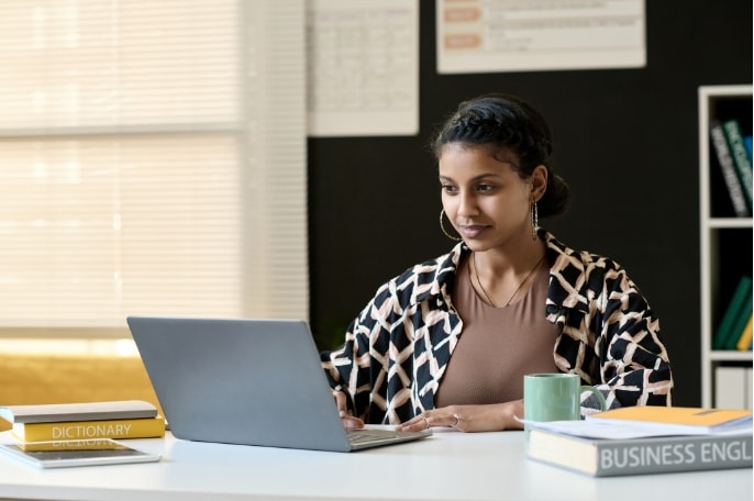 worker at desk with laptop